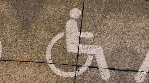 handicap logo spray painted on the ground