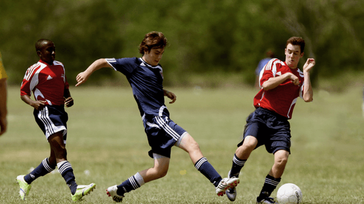 Senior students playing soccer