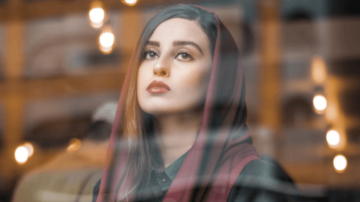 foreign woman looking outside the window
