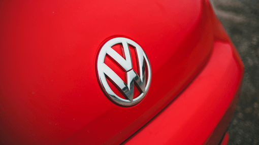 volkswagen logo on red vehicle