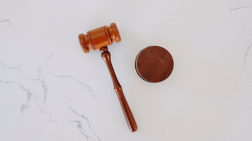 gavel on top of a marble table